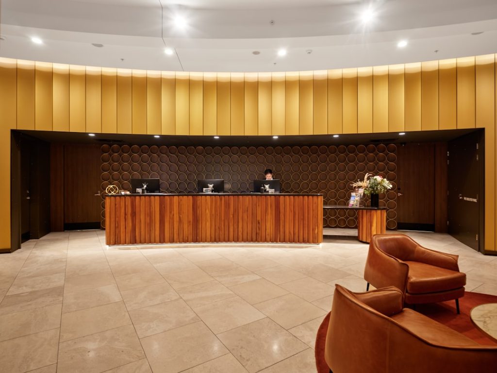 Modern hotel reception desk representing hospitality staffing and automation in tourism