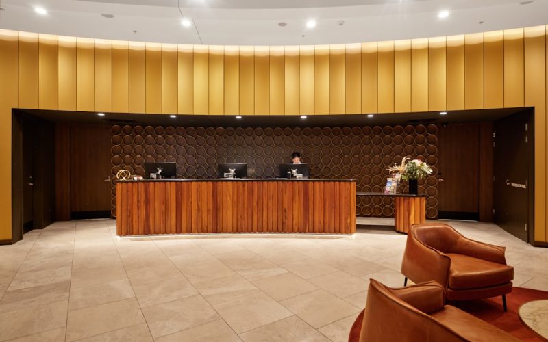 Modern hotel reception desk representing hospitality staffing and automation in tourism